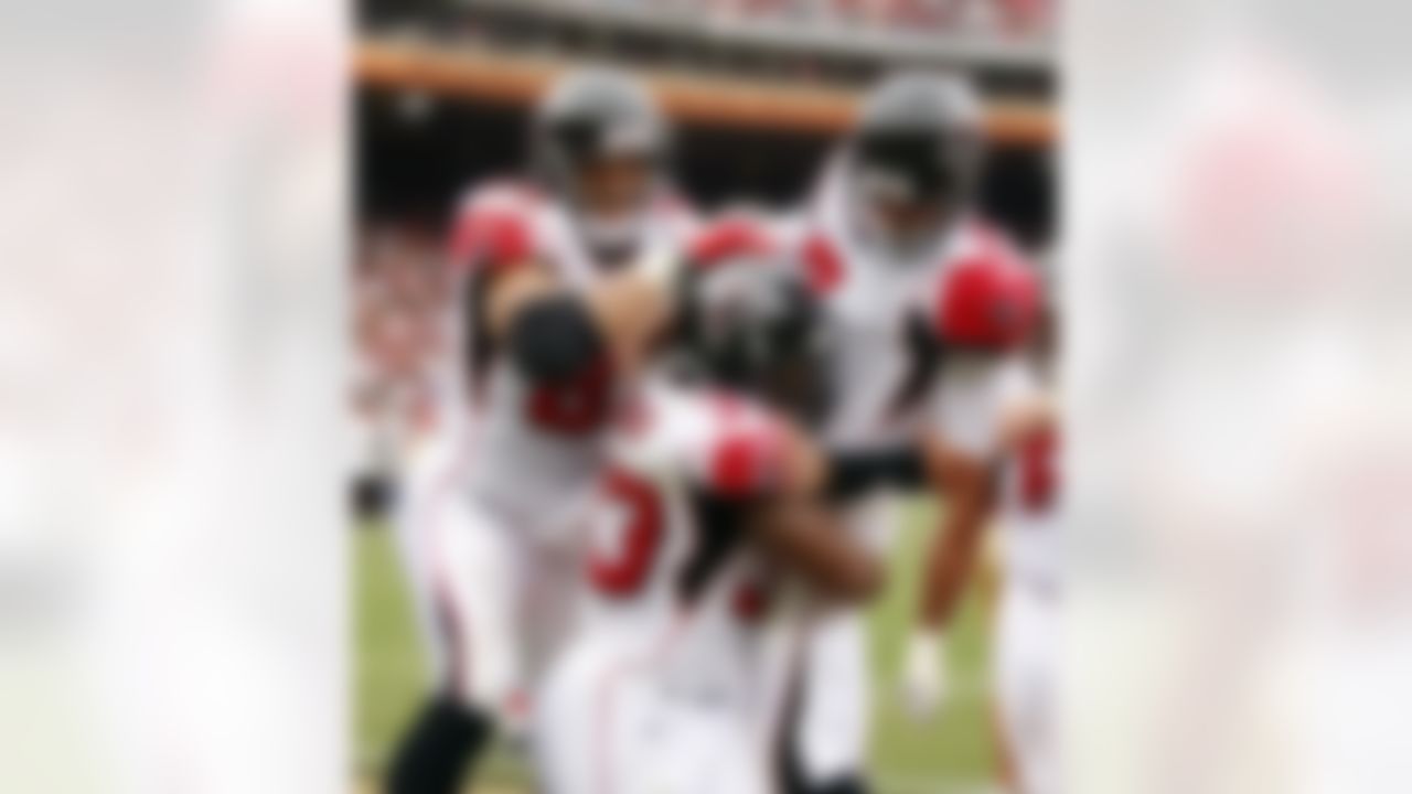 Atlanta Falcons quarterback Matt Ryan (2) celebrates a touchdown with teammates Michael Turner (33) and Tony Gonzalez (88) in the second quarter of their NFL football game against the San Francisco 49ers in San Francisco, Sunday, Oct. 11, 2009. (AP Photo/Ben Margot)