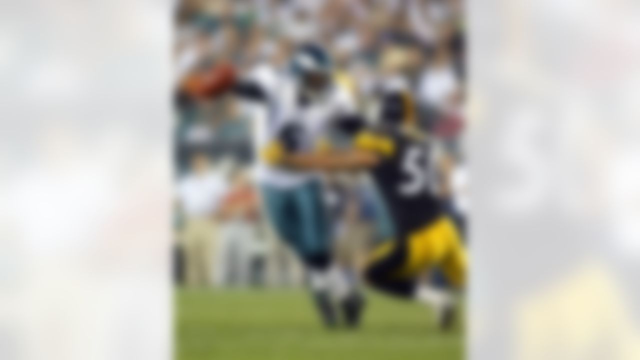 PHILADELPHIA - AUGUST 25: Donovan McNabb #5 of the Philadelphia Eagles scrambles against Larry Foote #50 of the Pittsburgh Steelers August 25, 2006 at Lincoln Financial Field in Philadelphia, Pennsylvania. The Eagles defeated the Steelers 16 to 7. Photo by Getty Images.