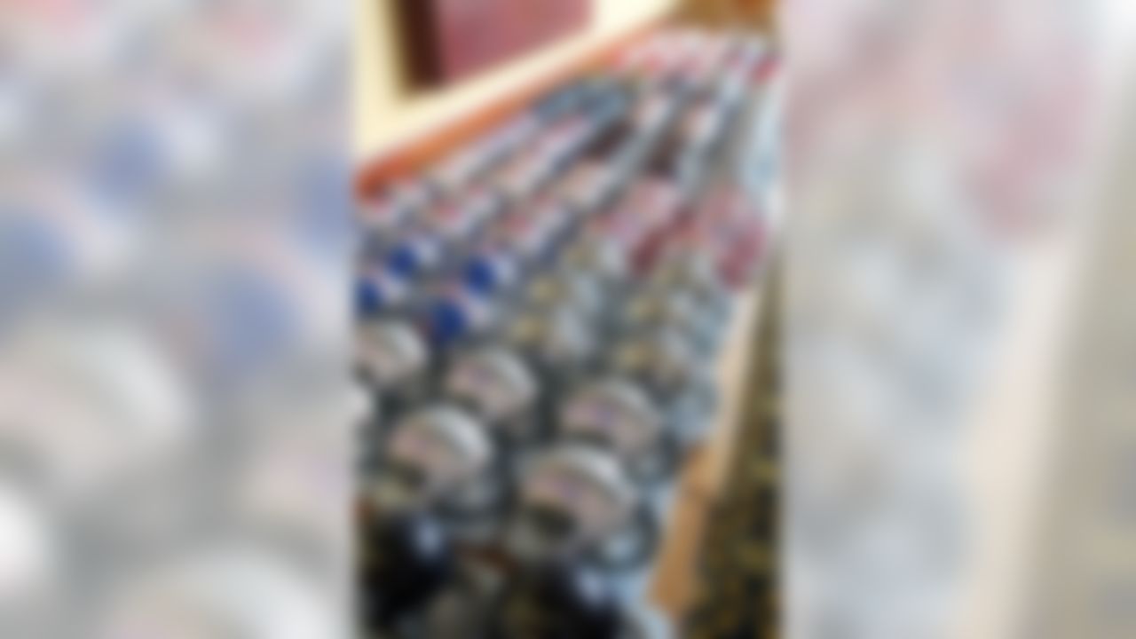 Helmets signed by Hall of Famers are seen at the McKinley Grand Hotel in Canton, Ohio on August 3, 2012.  (Ben Liebenberg/NFL)