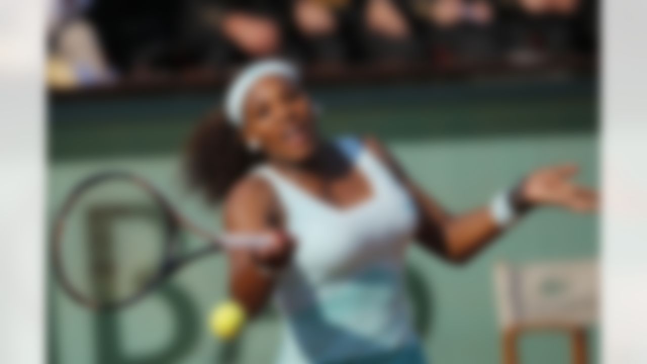 USA's Serena Williams returns the ball to France's Virginie Razzano during their first round match in the French Open tennis tournament at the Roland Garros stadium in Paris, Tuesday, May 29, 2012. (AP Photo/Christophe Ena)