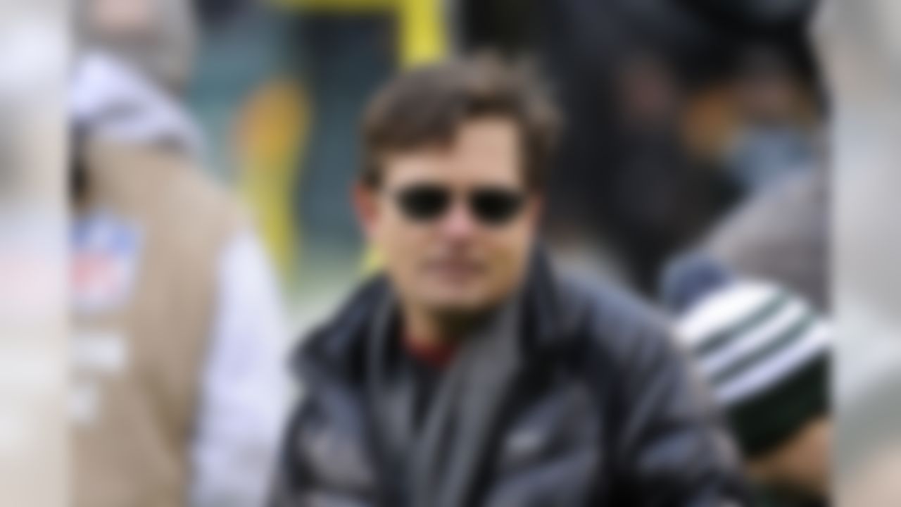Michael J. Fox stands on the sideline before an NFL football game, Sunday, Dec. 8, 2013, in East Rutherford, N.J. (AP Photo/Bill Kostroun)