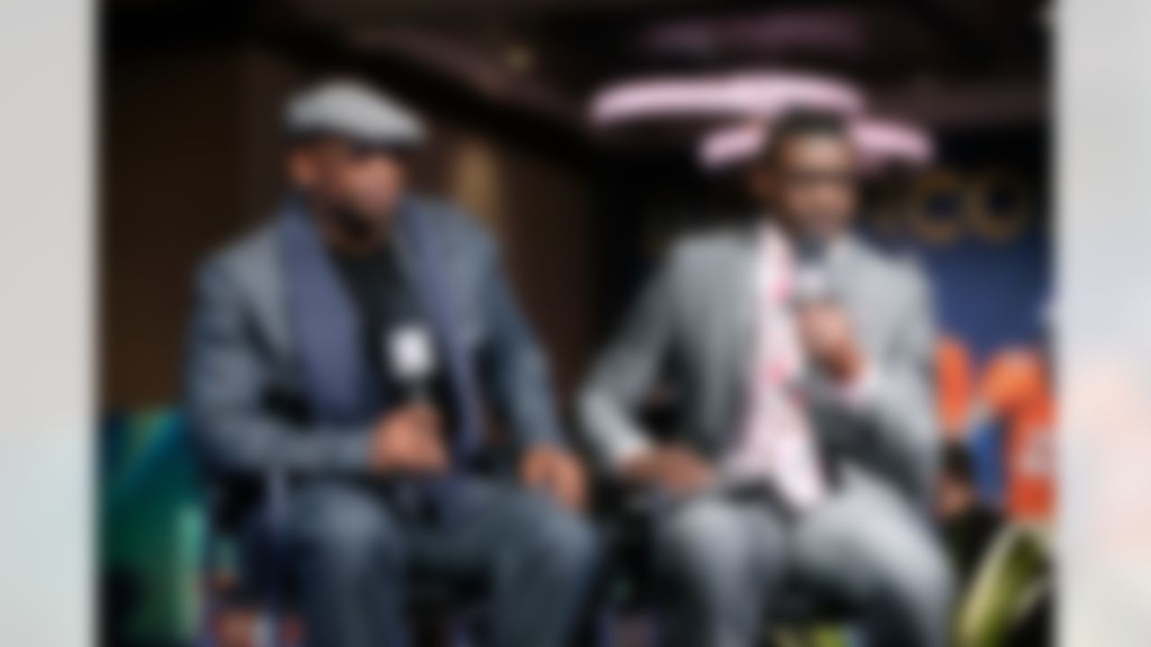 NFL Network's Deion Sanders and Michael Irvin speak on set on Radio Row at the Super Bowl XLVIII media center in the Sheraton Hotel on Wednesday, January 29, 2014 in New York, NY. (Perry Knotts/NFL)