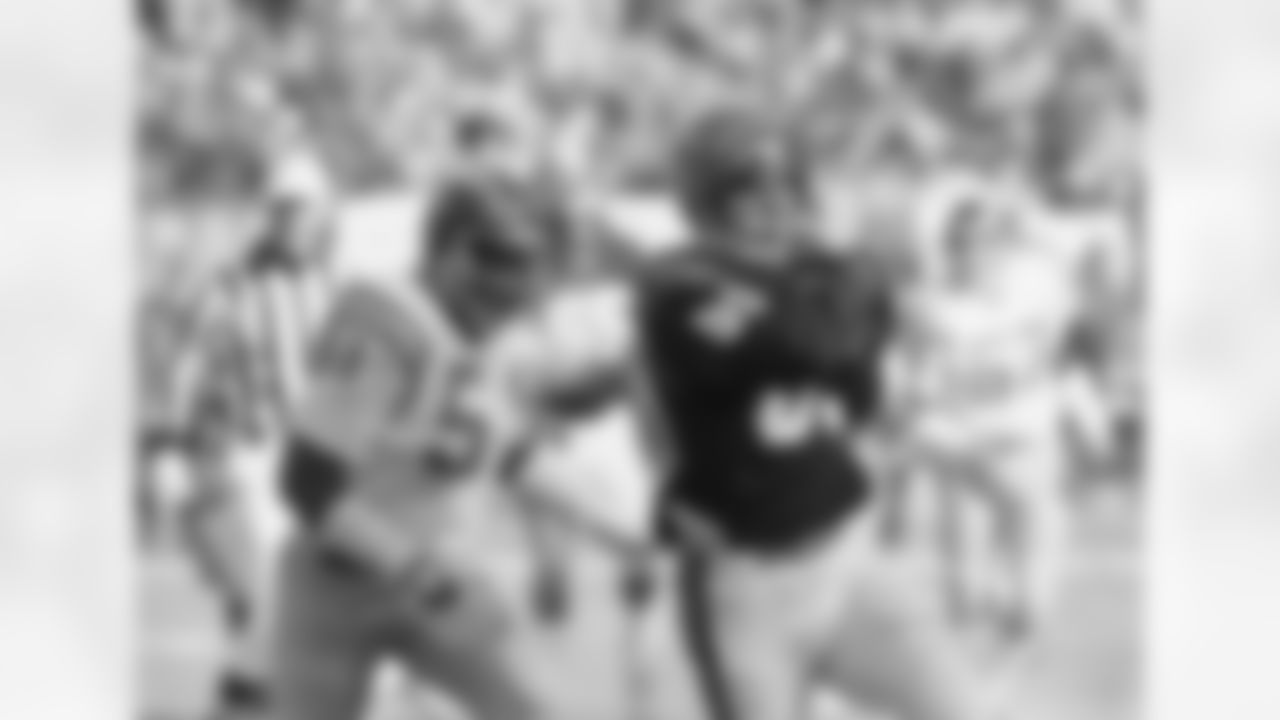 Cincinnati Bengals tight end Dan Ross (right) drives for yardage after a pass reception from Bengals quarterback Ken Andersen (not pictured) during the AFC Championship game against the San Diego chargers on Sunday, Jan. 10, 1982 in Cincinnati, Ohio. Chargers linebacker Woodrow Lowe makes the tackle on the play. (Associated Press)