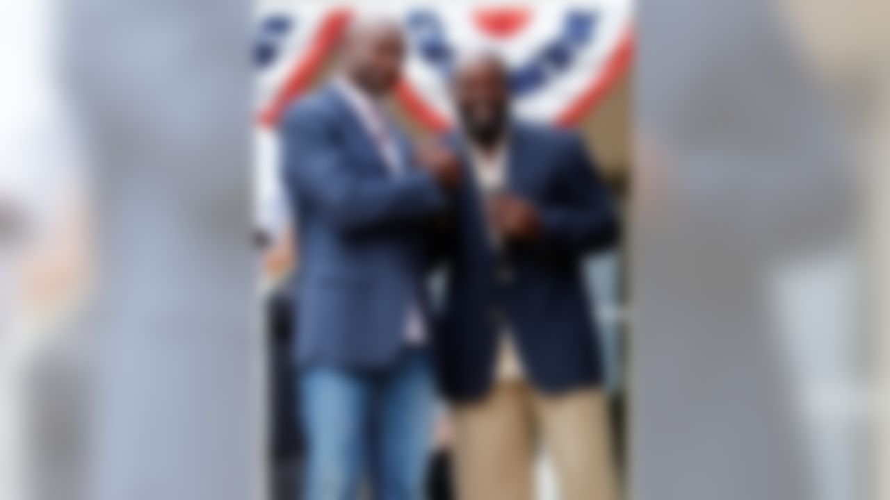 Jerry Rice and Emmitt Smith participate in the ringing of the closing bell on the New York Stock Exchange at the Pro Football Hall of Fame in Canton, Ohio on Aug. 6, 2010. (Ben Liebenberg/NFL)