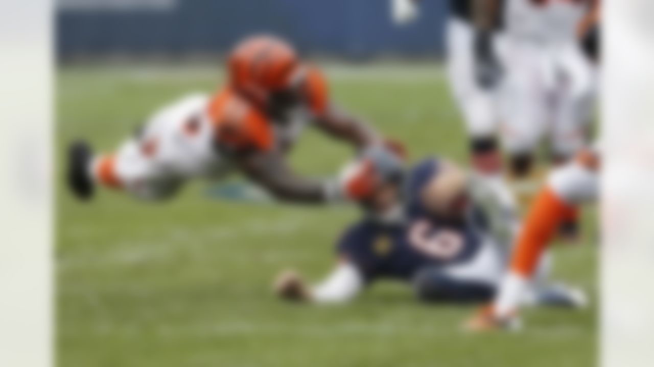 Cincinnati Bengals linebacker Vontaze Burfict (55) puts his hands on Chicago Bears quarterback Jay Cutler's helmet as Cutler slides. No penalty was called, but the Bears still managed to win, 24-21. (AP Photo/Charles Rex Arbogast)