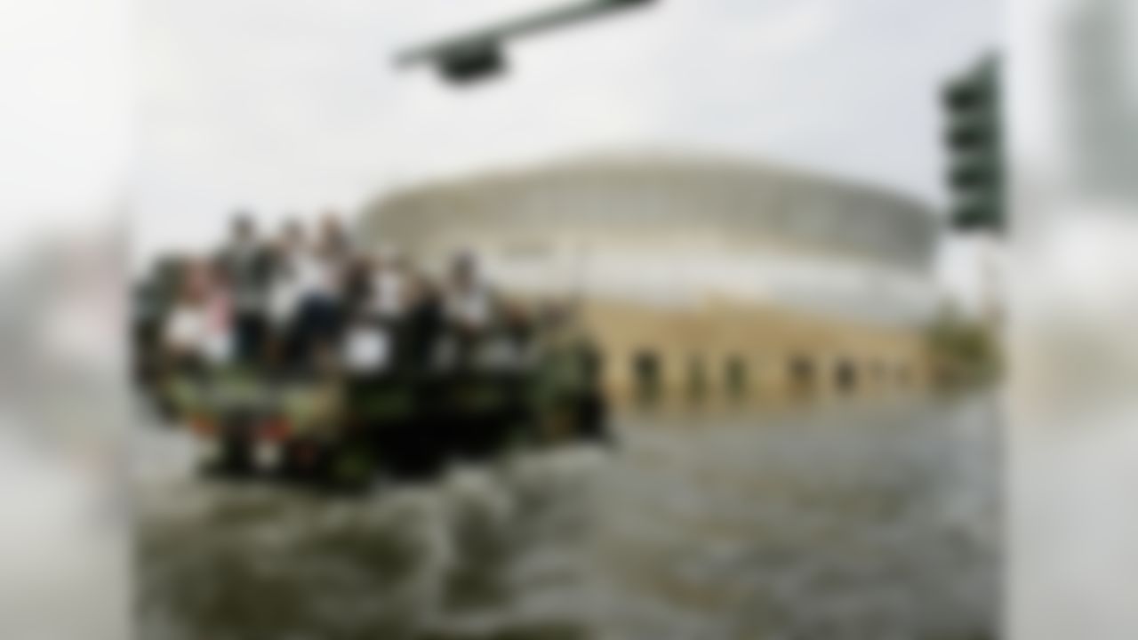 National Guard trucks haul residents through floodwaters to the Superdome after Hurricane Katrina hit in New Orleans, Tuesday, Aug. 30,  2005. Officials called for a mandatory evacuation of the city, but many residents remained.