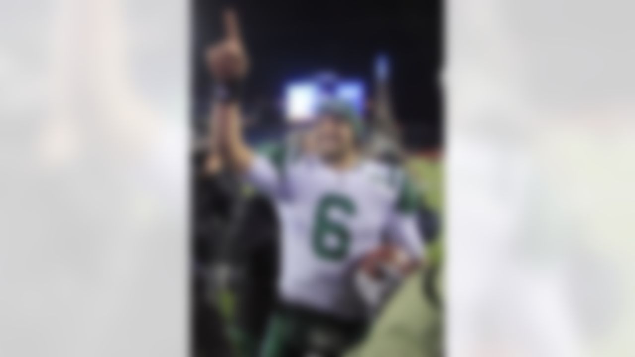 New York Jets quarterback Mark Sanchez celebrates his team's 28-21 win over the New England Patriots in an NFL divisional playoff football game in Foxborough, Mass., Sunday, Jan. 16, 2011. (AP Photo/Charles Krupa)