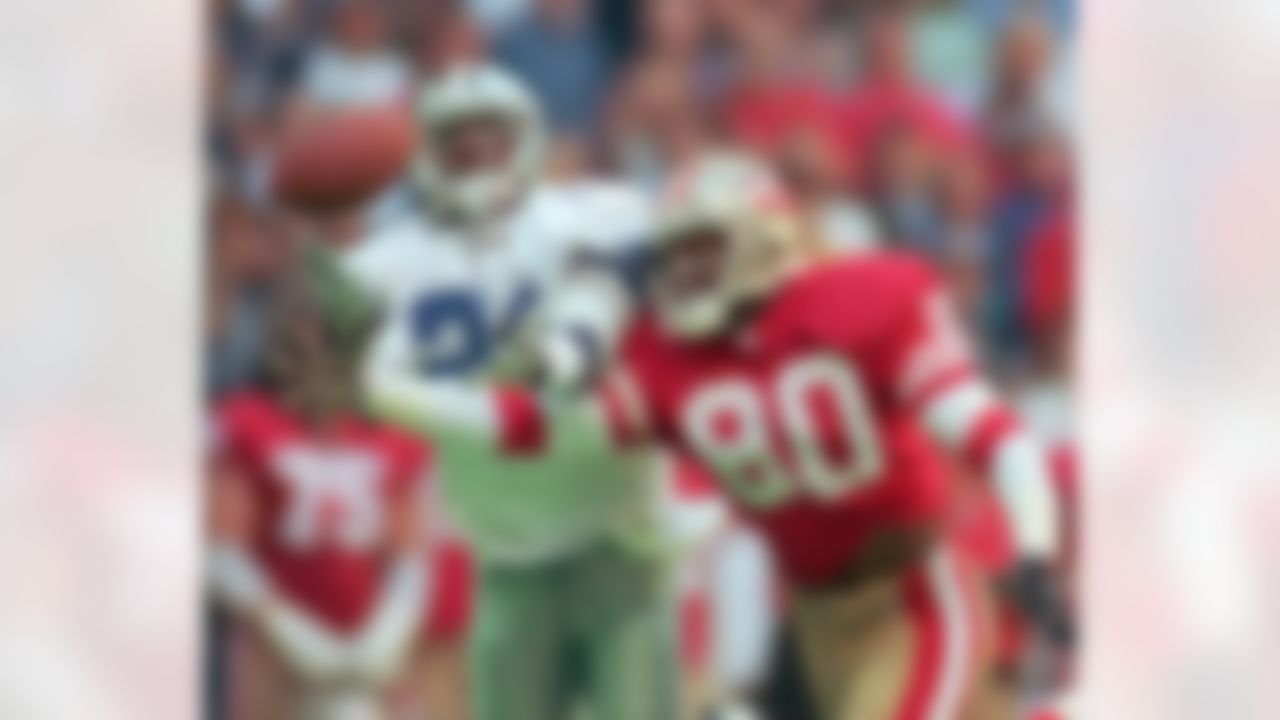 Dallas Cowboys defender Deion Sanders (21) knocks the ball away from San Francisco 49ers receiver Jerry Rice (80) in the second quarter in Irving, Texas, Sunday, Nov. 12, 1995. (AP Photo/Eric Gay)