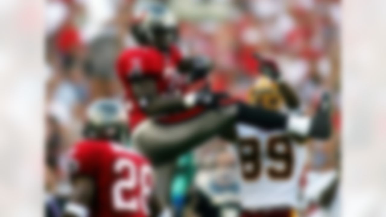 TAMPA, FL - NOVEMBER 25: Defensive back Phillip Buchanon #31 of the Tampa Bay Buccaneers brakes up a pass against Santana Moss #89 of the Washington Redskins on November 25, 2007 at Raymond James Stadium in Tampa, Florida. (Photo by Marc Serota/Getty Images)
