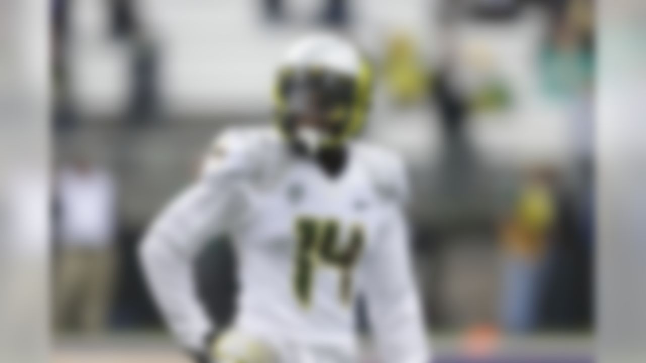 Oregon cornerback Ifo Ekpre-Olomu walks on the field before an NCAA college football game against Washington on Oct. 12, 2013, in Seattle. (AP Photo/Ted S. Warren)