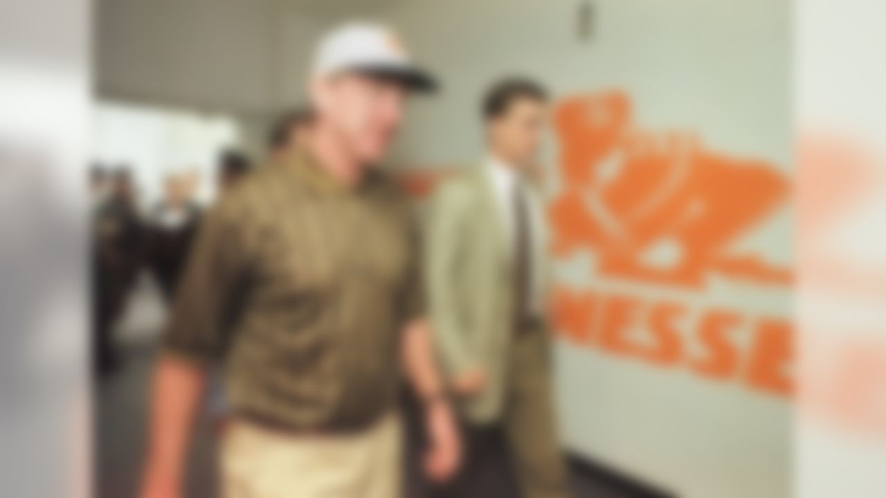 Archie Manning, left, walks with his son, University of Tennessee quarterback Peyton Manning, as they leave Neyland Stadium following a game in 1997 in Knoxville, Tenn. (AP Photo/Wade Payne)