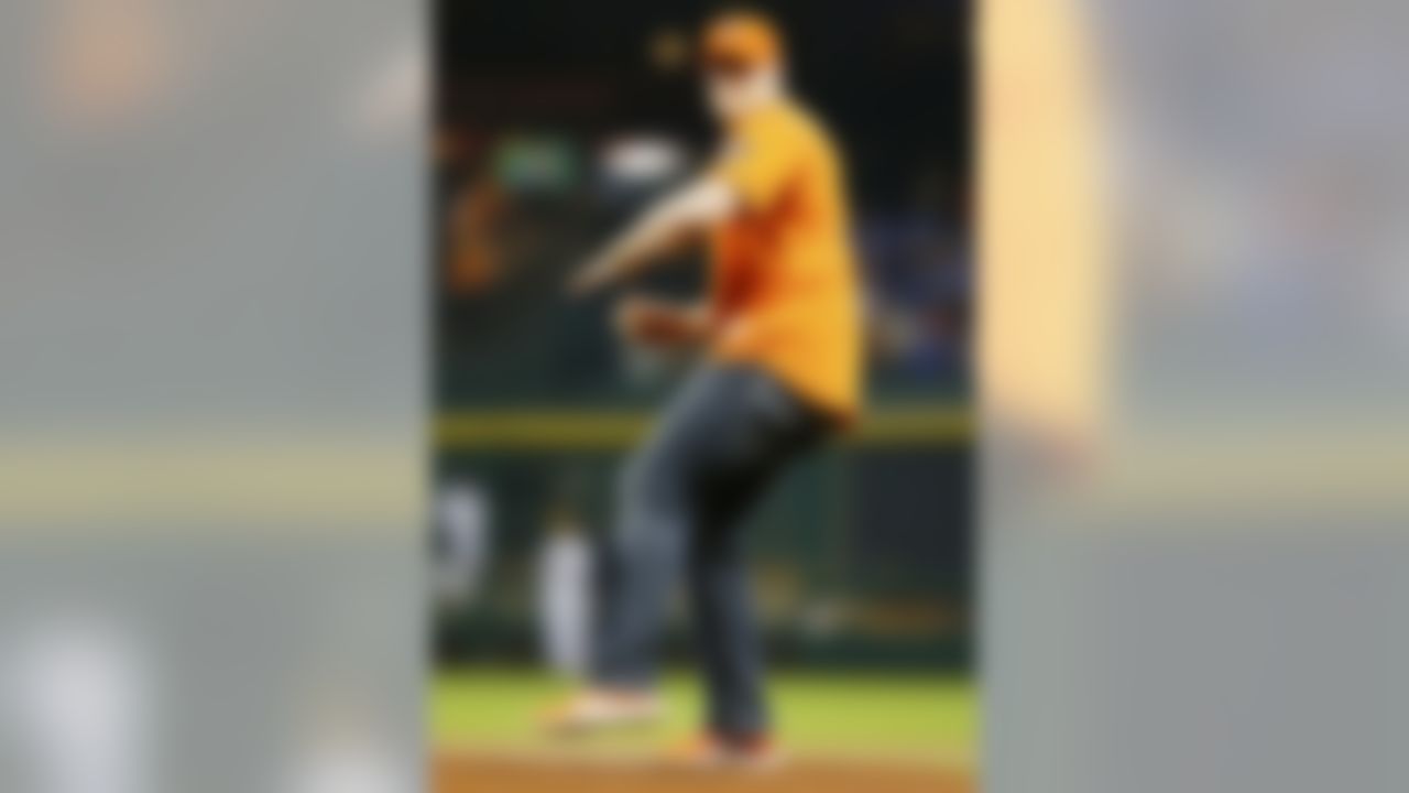 Houston Texans defensive end J.J. Watt (99) throws out the first pitch during Opening Day of an MLB baseball game between the Texas Rangers against the Houston Astros at Minute Maid Park on Sunday March 31, 2013 in Houston, Texas. Houston won 8-2. (AP Photo/Aaron M. Sprecher)