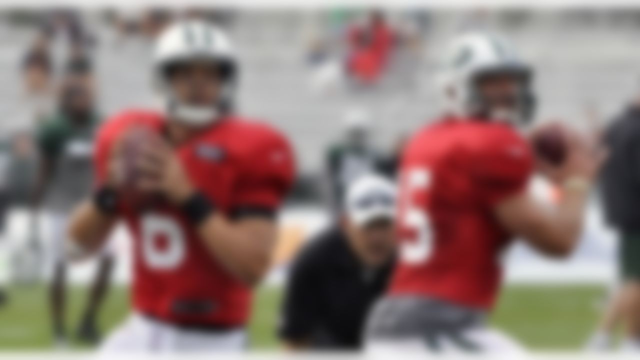Mark Sanchez, left, and Tim Tebow set to throw during drills at New York Jets training camp in Cortland, N.Y., Tuesday, Aug. 14, 2012. (AP Photo/Kevin Rivoli)