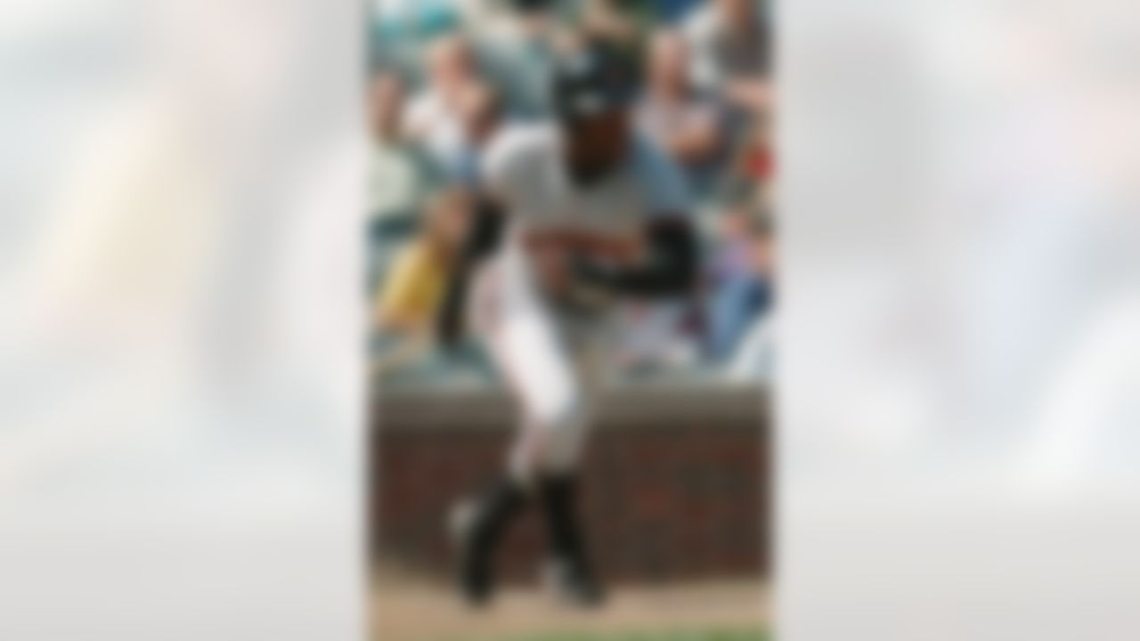 San Francisco Giants' Deion Sanders takes off on a single during the first inning against the Chicago Cubs, Saturday, Sept. 9 1995, in Chicago. In a team meeting, Dallas Cowboys owner Jerry Jones announced that cournerback Sanders has agreed to a five-year deal with the team. (AP Photo/Fred Jewell)