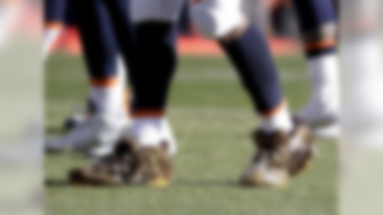 Denver Broncos outside linebacker Von Miller wears fur on his cleats during warm ups before an NFL football game against the New England Patriots Sunday, Dec. 18, 2016, in Denver. (AP Photo/Jack Dempsey)