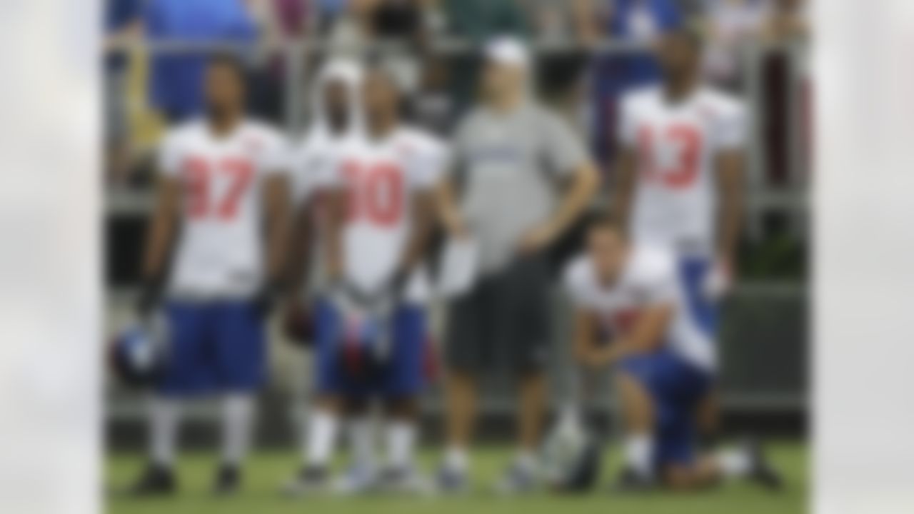 New York Giants wide receivers coach Kevin M. Gilbride, third from left, watches a practice with wide receivers Dominik Hixon (87), Hakeem Nicks, Victor Cruz (80), Dan DePalma (15) and Ramses Barden at the New York Giants NFL football training camp in Albany, N.Y., Saturday, July 28, 2012. (AP Photo/Kathy Willens)