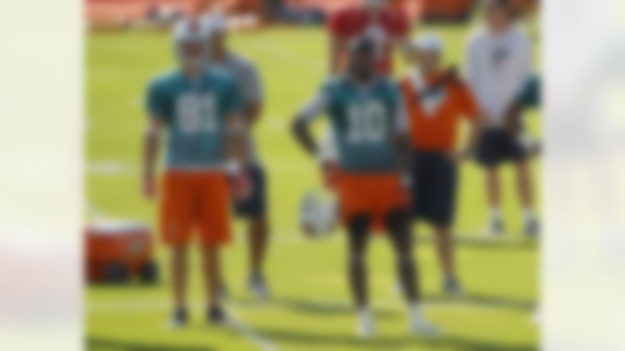 Miami Dolphins' Clyde Gates (10) and Chris Hogan (81) watch during NFL football training camp practice in Davie, Fla., Friday, July 27, 2012. (AP Photo/Alan Diaz)