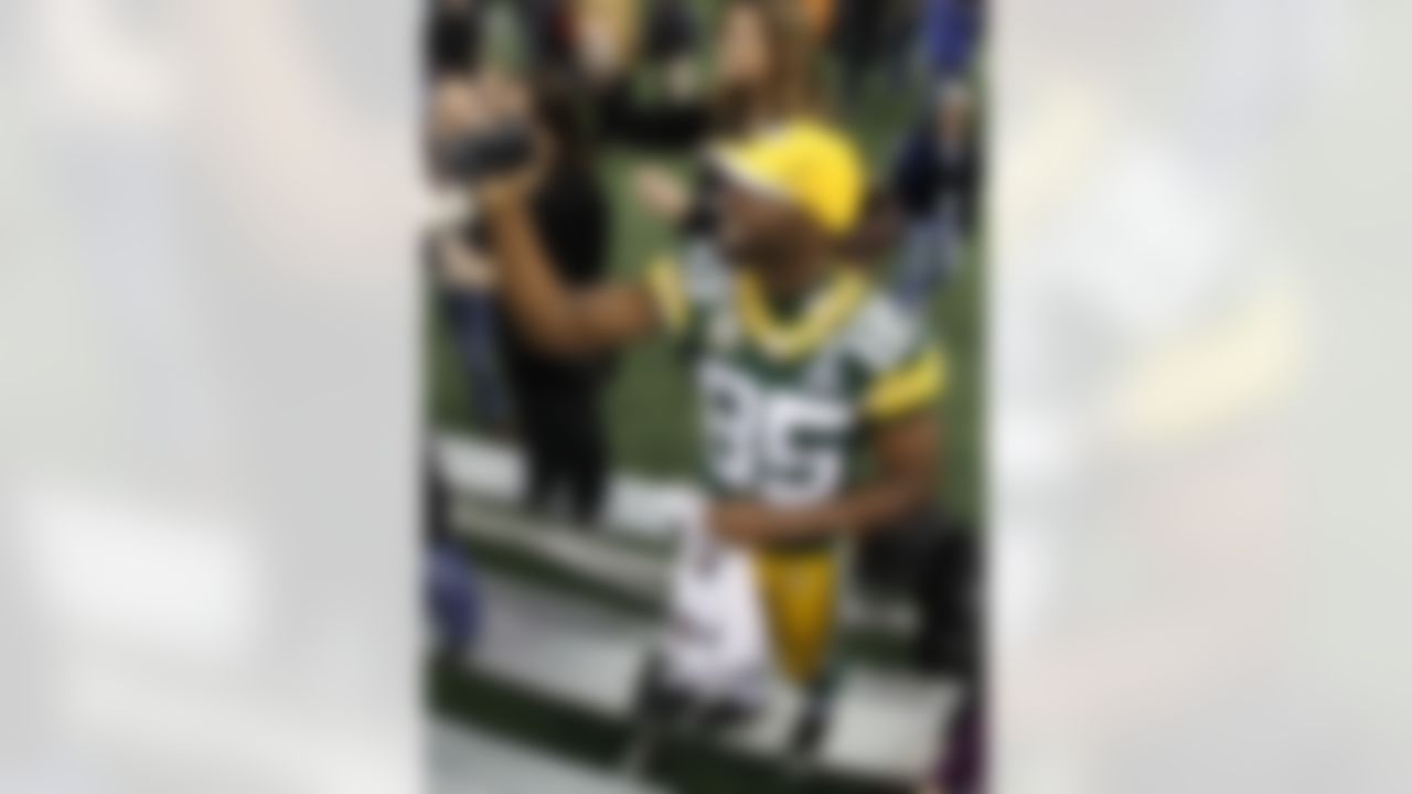 Green Bay Packers' Greg Jennings shoots video during media day for NFL football Super Bowl XLV Tuesday, Feb. 1, 2011, in Arlington, Texas. (AP Photo/Charlie Riedel)