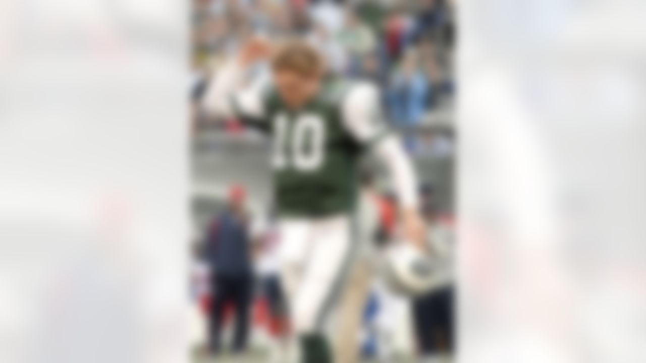 New York Jets quarterback # 10 Chad Pennington coming off the field after being sacked by Houston Texans # 90 defensive end Mario Williams showing the fans he was ok during the Houston Texans vs New York Jets game on November 26 , 2006 at Giants Stadium East Rutherford , New Jersey. Photo by Tom Berg/Getty Images.