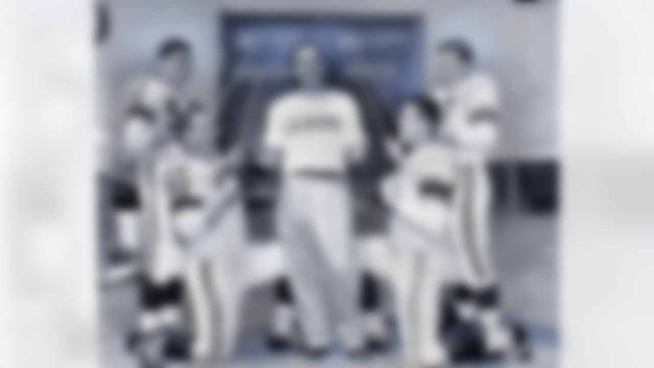 LOS ANGELES, CA - AUGUST 1: Head coach Sid Gillman of the Los Angeles Rams poses for a photo with linebackers Dick Daugherty #50 and Bob Dougherty #57and defensive tackle Art Hauser #65 and center John Houser #63 on August 1, 1957 in Los Angeles, California. (Photo by Pro Football Hall of Fame/NFL Photos/Getty Images)