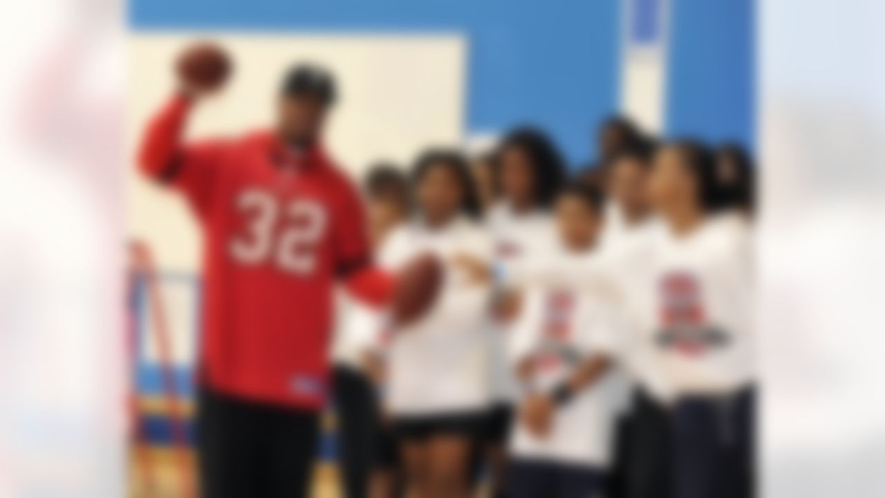 Tampa Bay Buccaneers running back Mossis Madu runs drills with students during a Play 60 event at the Harris Academy on October 18, 2011 in London, England. (Sean Ryan/NFL)