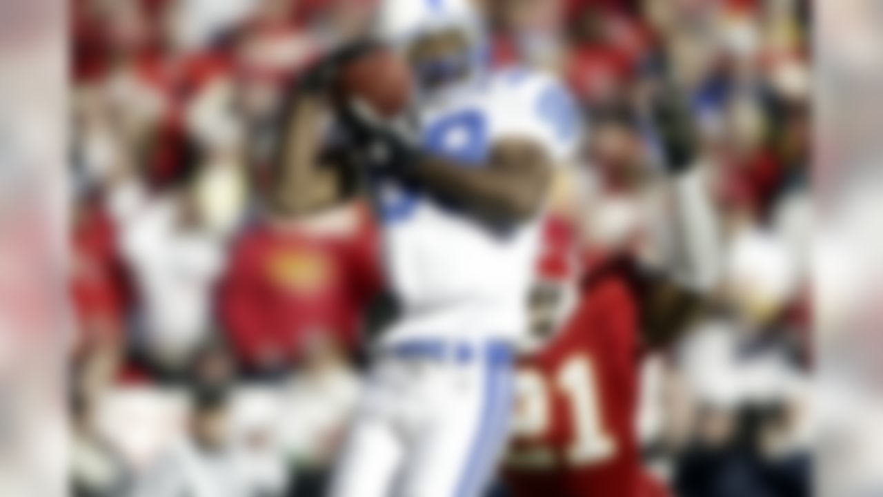 Wide receiver Marvin Harrison of the Indianapolis Colts catches a pass during an AFC Divisional Playoff NFL football game against the Kansas City Chiefs on Jan. 11, 2004. (AP Photo/G. Newman Lowrance)