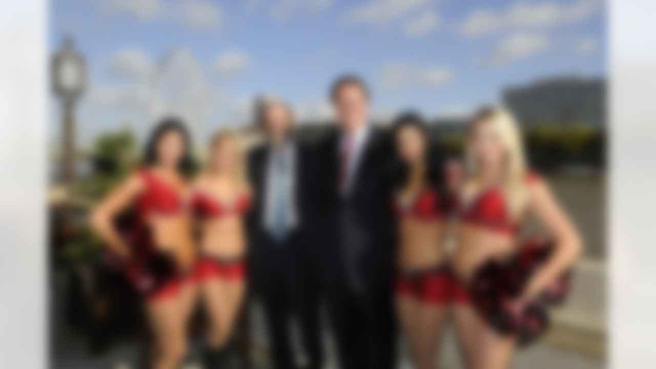 Deputy Leader of the House of Commons David Heath (left) and John York, owner of the San Francisco 49ers pose with Tampa Bay Buccaneers outside of the Houses of Parliament in London, England on October 18, 2011. (Dave Shopland/NFL)