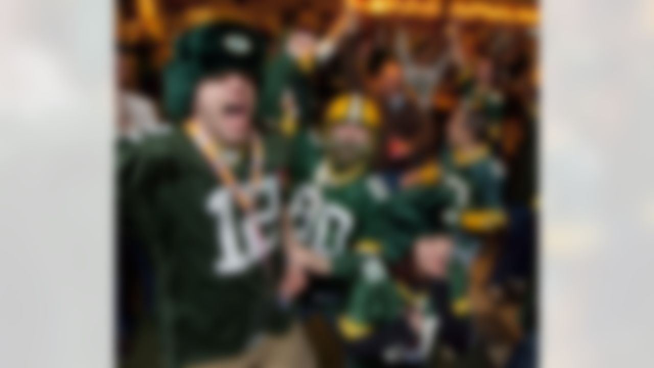 Green Bay Packers fans celebrate Sunday, Feb. 6, 2011, at the Stadium View Bar near Lambeau Field in Green Bay, Wis. after the Packers won Super Bowl XLV. (AP Photo/Mike Roemer)