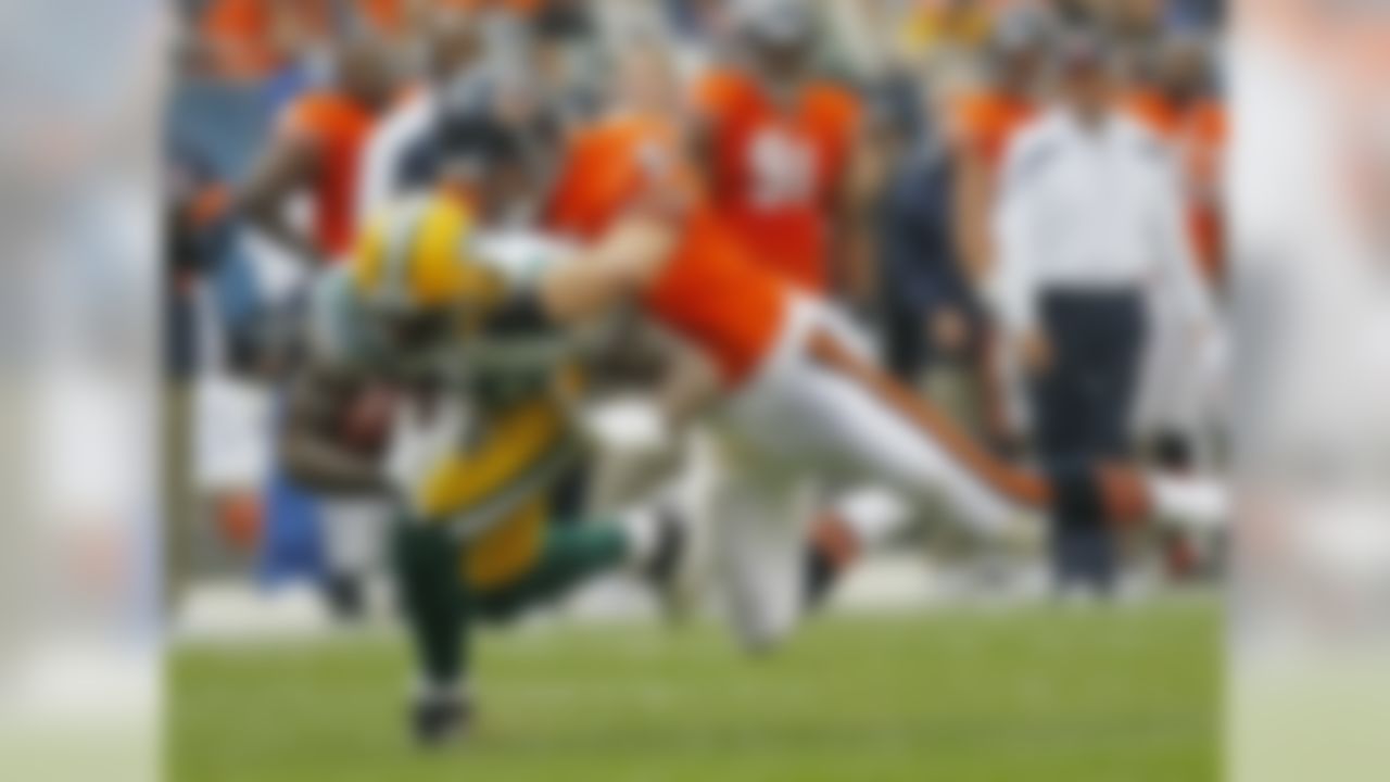 Green Bay Packers tight end Jermichael Finley (88) is tackled by Chicago Bears linebacker Brian Urlacher (54) in the first half of an NFL football game in Chicago, Sunday, Sept. 25, 2011. (AP Photo/Charles Rex Arbogast)