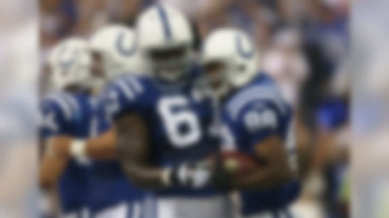 INDIANAPOLIS - SEPTEMBER 06:  Marvin Harrison #88 of the Indianapolis Colts is congratulated by teammate Tony Ugoh #67 on his first quarter touchdown reception against the New Orleans Saints in the first NFL game of the season at the RCA Dome on September 6, 2007 in Indianapolis, Indiana.  (Photo by Jonathan Daniel/Getty Images)