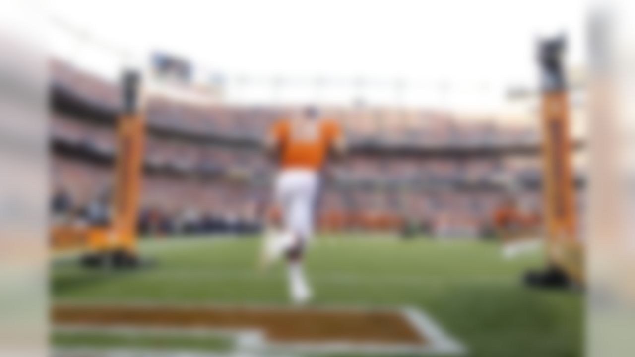 Denver Broncos quarterback Peyton Manning runs on the the field for the first time as a Denver Broncos player during an NFL game against the Pittsburgh Steelers, Sunday, Sept. 9, 2012 in Denver. The Broncos won the game, 31-19. (Ric Tapia/NFL)
