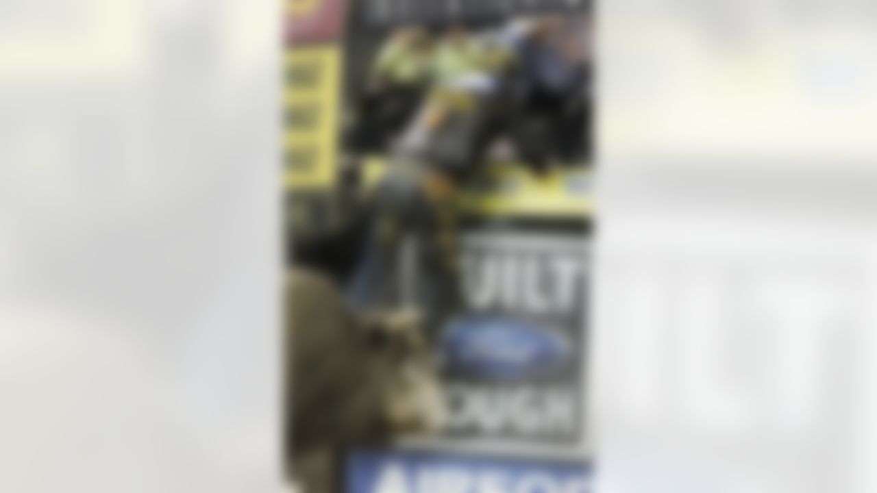 A bull named Deja Blu chases Cincinnati Bengal receiver Chad Ochocinco after an attempted ride during the Professional Bull Riders' Lucas Oil Invitation bull riding event in Duluth, Ga., Saturday, May 14, 2011. (AP Photo/John Bazemore)