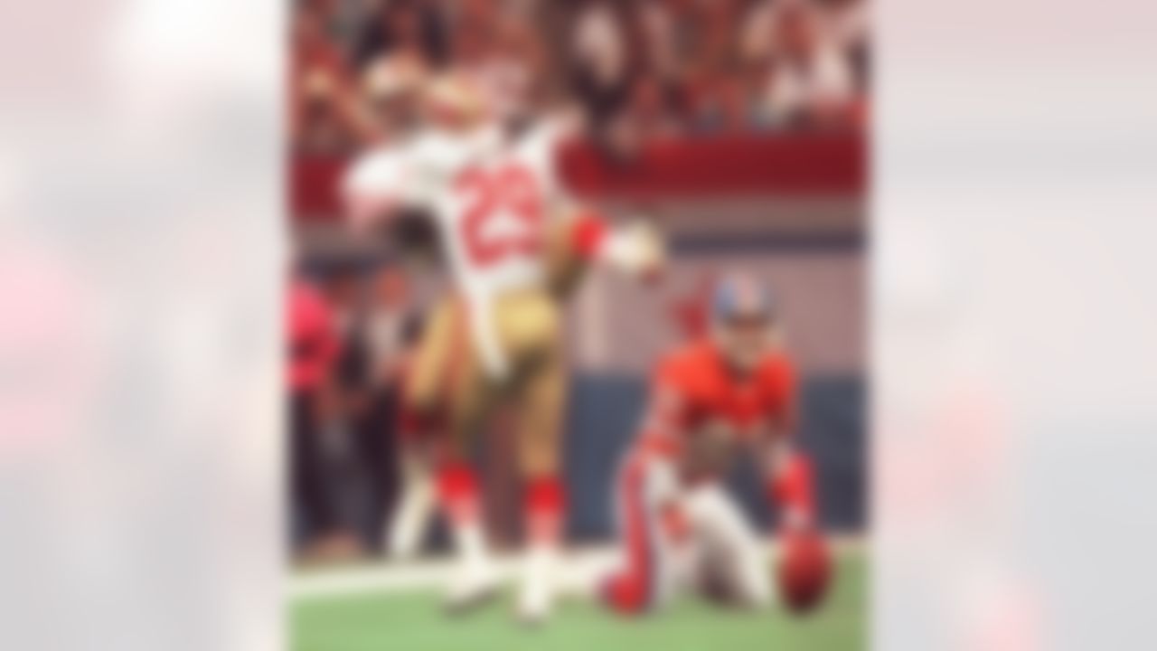 San Francisco 49ers Don Griffin (29) and Tim McKyer (22) celebrate after breaking up a Denver Broncos pass from John Elway to wide receiver Mark Jackson, right, during Super Bowl XXIV in New Orleans, La., Jan. 28, 1990. (AP Photo/Reed Saxon)