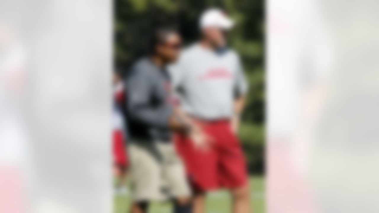 Arizona Cardinals head coach Ken Whisenhunt, right, listens as defensive coordinator Ray Horton talks during NFL training camp football practice at Northern Arizona University Thursday, July 26, 2012, in Flagstaff, Ariz.(AP Photo/Ross D. Franklin)