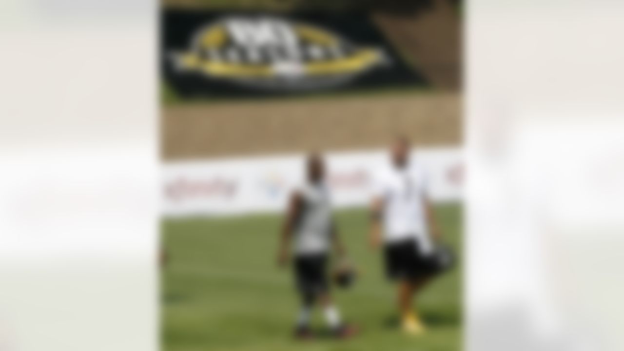 Pittsburgh Steelers quarterback Ben Roethlisberger (7) and defensive back Ike Taylor take the field for their first practice at NFL football of training camp in Latrobe, Pa., Thursday, July 26, 2012. (AP Photo/Keith Srakocic)