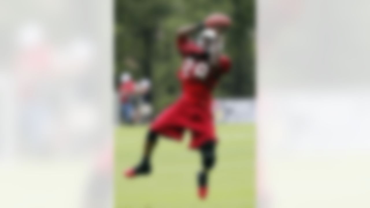 Arizona Cardinals' Greg Toler makes a catch during NFL football training camp at Northern Arizona University, Thursday, July 26, 2012, in Flagstaff, Ariz. (AP Photo/Ross D. Franklin)
