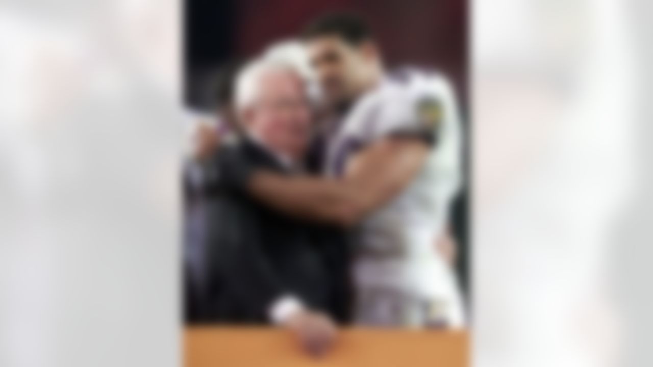 Baltimore Ravens Michael McCrary (99) hugs owner Art Modell after the Ravens won Super Bowl XXXV 34-7 over the New York Giants in Tampa, Fla. Sunday, Jan. 28, 2001. (AP Photo/Amy Sancetta)