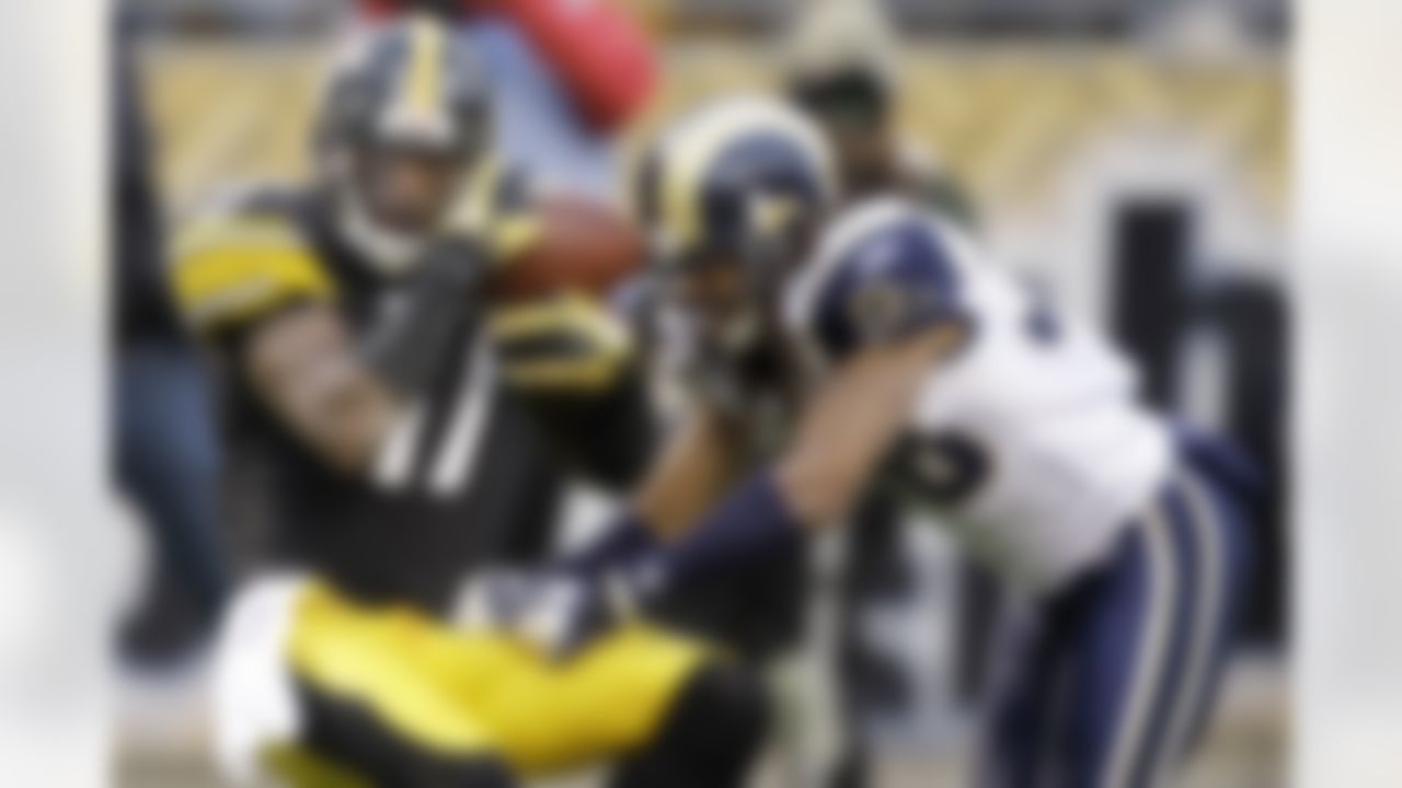 Pittsburgh Steelers wide receiver Mike Wallace (17) pulls in a pass for a 46-yard gain from Charlie Batch in front of St. Louis Rams cornerback Josh Gordy (38) in the fourth quarter of the NFL football game on Saturday, Dec. 24, 2011, in Pittsburgh. Wallace was down at the one upon review. (AP Photo/Gene J. Puskar)