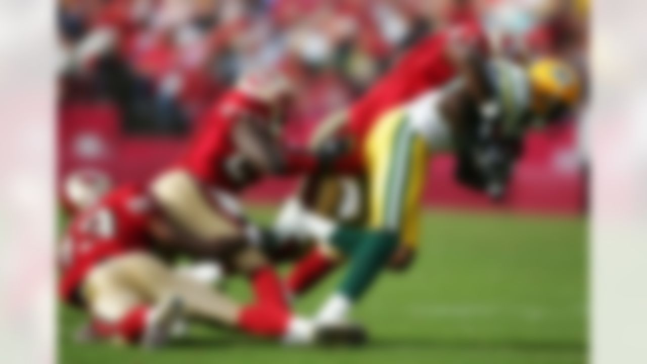 SAN FRANCISCO - DECEMBER 10: Donald Driver #80 of the Green Bay Packers runs with the ball against Walt Harris #17, Marcus Hudson #23 and Arnaz Battle #83 of the San Francisco 49ers at Monster Park December 10, 2006 in San Francisco, California. Photo by Getty Images.