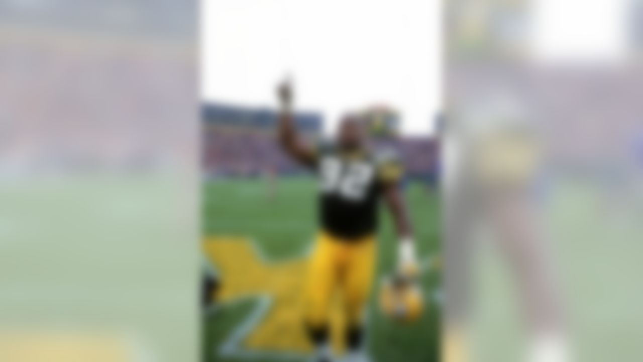 Green Bay Packers defensive end Reggie White (92) celebrates as he walks off the field after an NFL football game against the Chicago Bears at Lambeau Field on October 31, 1993 in Green Bay, Wisconsin. The Packers won 17-3. (AP Photo/David Stluka)