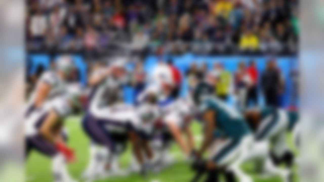 New England Patriots quarterback Tom Brady (12) calls a play at the line of scrimmage.