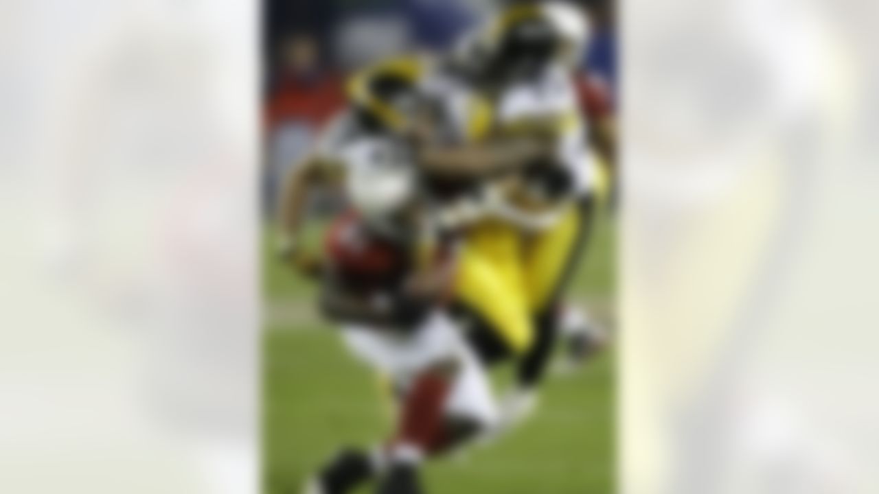 Arizona Cardinals wide receiver Anquan Boldin (81) is tackled by Pittsburgh Steelers linebacker James Farrior (51) and safety Ryan Clark during the third quarter of the NFL Super Bowl XLIII football game, Sunday, Feb. 1, 2009, in Tampa, Fla. (AP Photo/David J. Phillip)