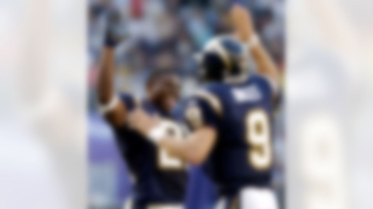 San Diego Chargers' LaDainian Tomlinson, left, celebrates with quarterback Drew Brees during the Chargers' 42-14 victory over the Oakland Raiders Sunday Oct. 31, 2004 in San Diego. (AP Photo/Denis Poroy)