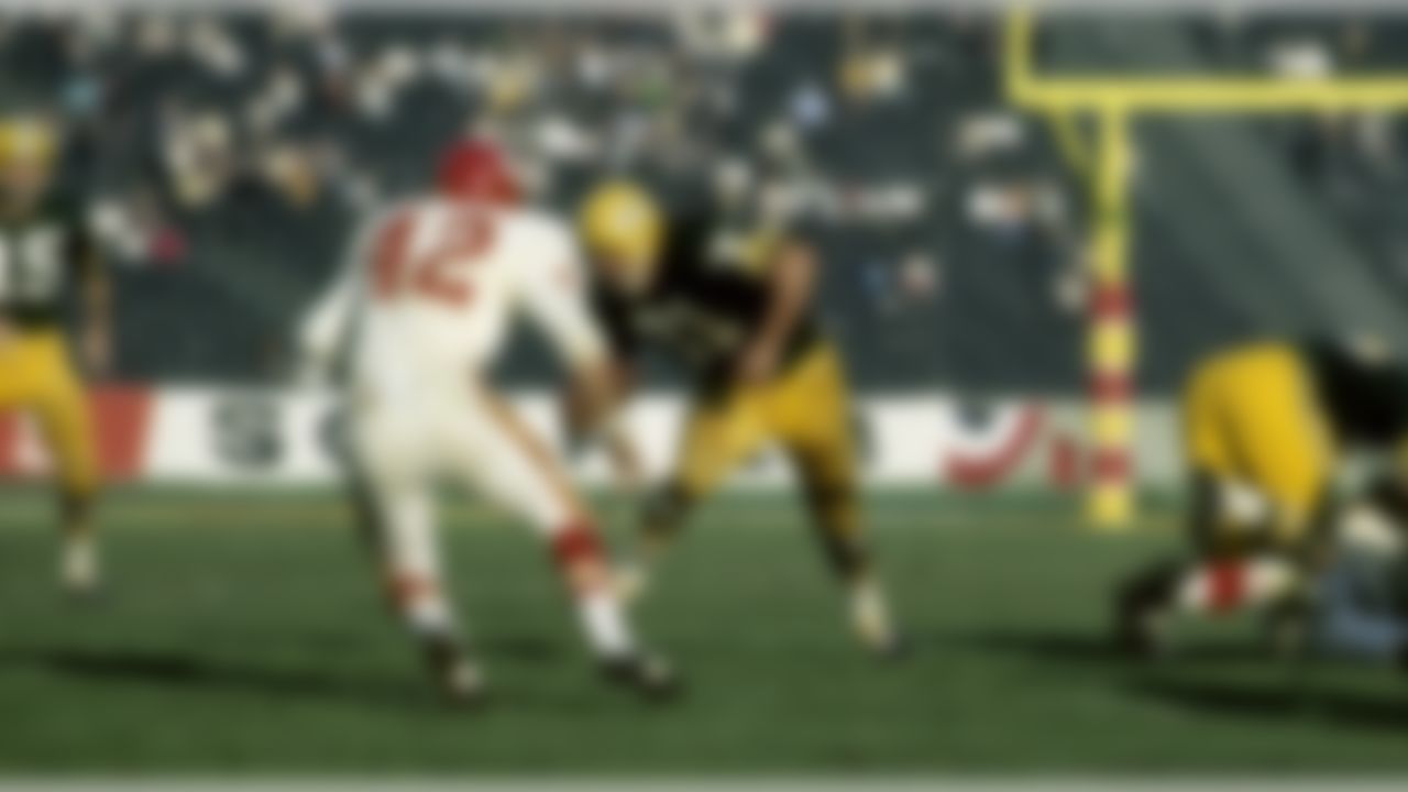 Green Bay Packers Hall of Fame fullback Jim Taylor (31) runs up the field against Kansas City Chiefs safety Johnny Robinson (42) during Super Bowl I on January 15, 1967, at the Los Angeles Memorial Coliseum in Los Angeles, California. (National Football League)