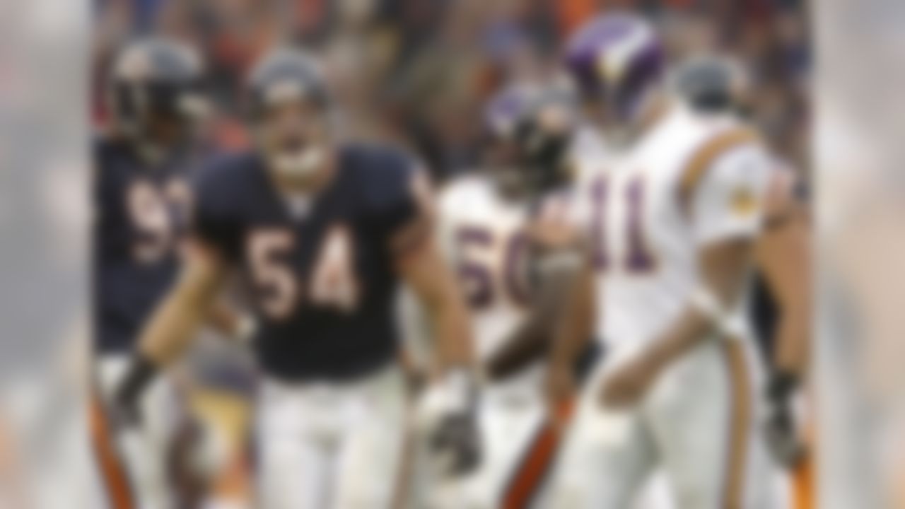 Chicago Bears linebacker Brian Urlacher (54) reacts after sacking Minnesota Vikings quarterback Daunte Culpepper (11) for a 7-yard loss in the fourth quarter Sunday, Dec. 5, 2004, in Chicago. The Bears won, 24-14. (AP Photo/Jeff Roberson)