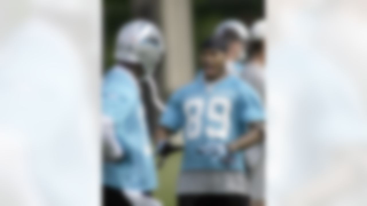 Carolina Panthers' receiver Steve Smith (89) shows some moves to Wallace Wright, left, during rookie football mini-camp on Saturday, May 1, 2010 in Charlotte, N.C. (AP Photo/Rick Havner)