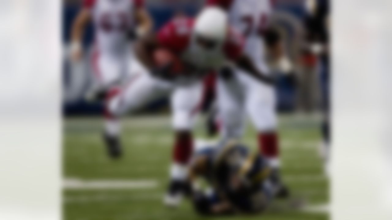 ST. LOUIS, MO - OCTOBER 7: J.J Arrington #28 of the Arizona Cardinals gets by Todd Johnson #35 of the St. Louis Rams at the Edward Jones Dome October 7, 2007 in St. Louis, Missouri. The Cardinals beat the Rams 34-31. (Photo by Dilip Vishwanat/Getty Images)