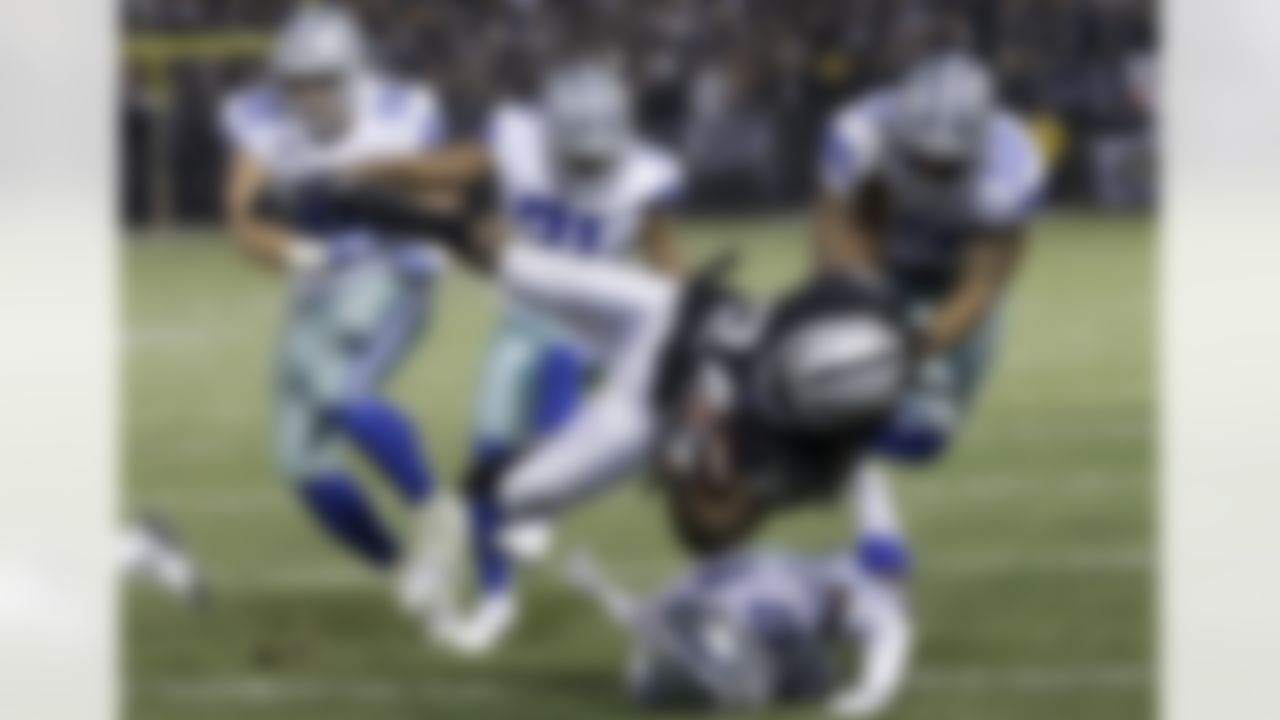 Oakland Raiders running back Marshawn Lynch (24) is tackled by Dallas Cowboys defenders during the second half of an NFL football game in Oakland, Calif., Sunday, Dec. 17, 2017.