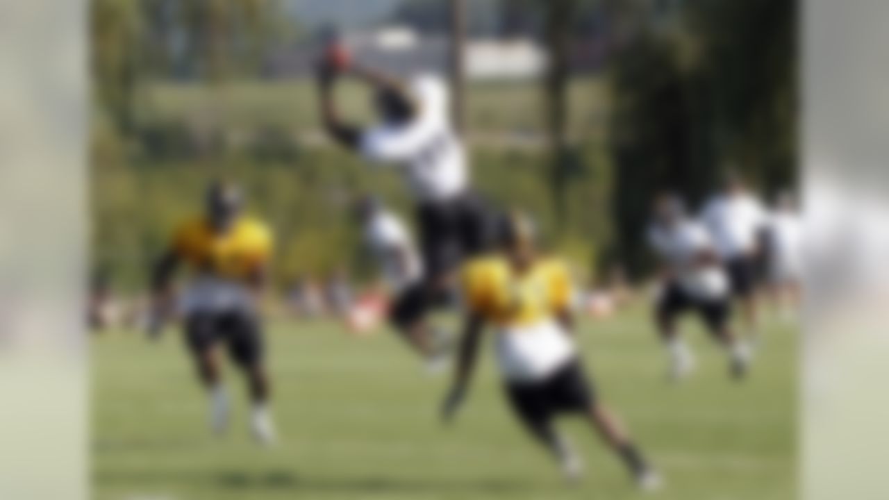 Pittsburgh Steelers wide receiver Toney Clemons (11) goes up for a pass over defensive back Terry Carter (35) during drills in practice at NFL football training camp in Latrobe, Pa., Sunday, July 29, 2012. (AP Photo/Keith Srakocic)