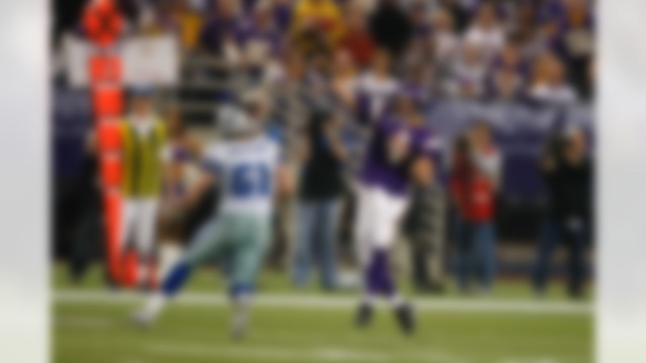 Quarterback Brett Favre #4 of the Minnesota Vikings passes the football against the Dallas Cowboys during the NFC Divisional Playoff Game at Mall of America Field at the Hubert H. Humphrey Metrodome on January 17, 2010 in Minneapolis, Minnesota. (AP Photo/Scott Boehm)